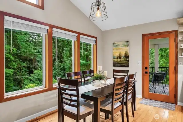 Dining room with view windows and a deck.