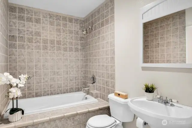 Primary bedroom with a soaking tub & shower.