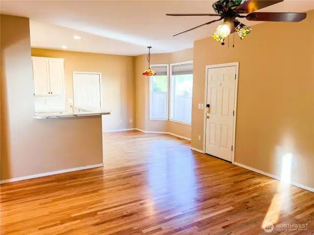L to R, kitchen, door to the attached garage, bay window with back yard views while you dine, and door to the back yard.