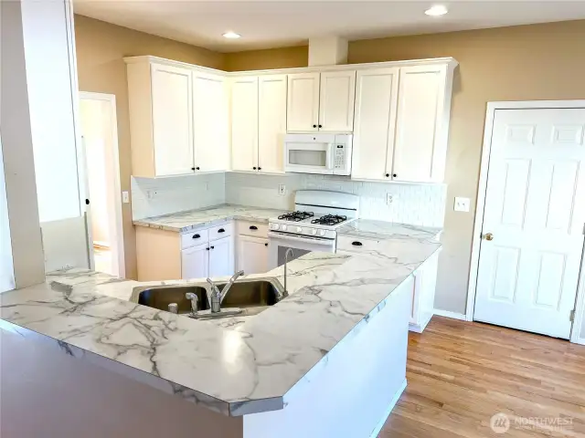 Plenty of cabinetry and attractive backsplash tile.