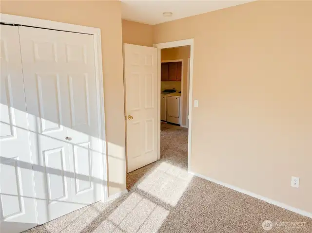 Laundry room is across the hall from first bedroom.