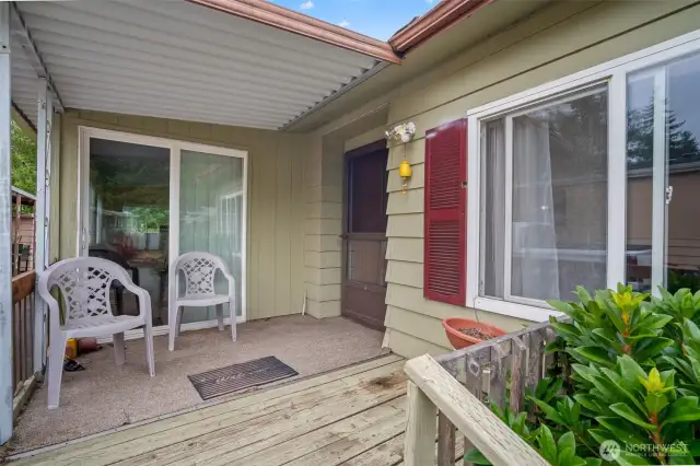 Inviting front porch with access to the sunroom as well.