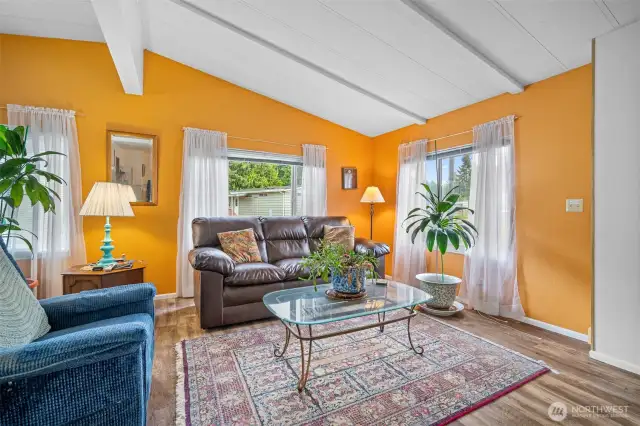 Comfortable and bright living room with vaulted ceilings.