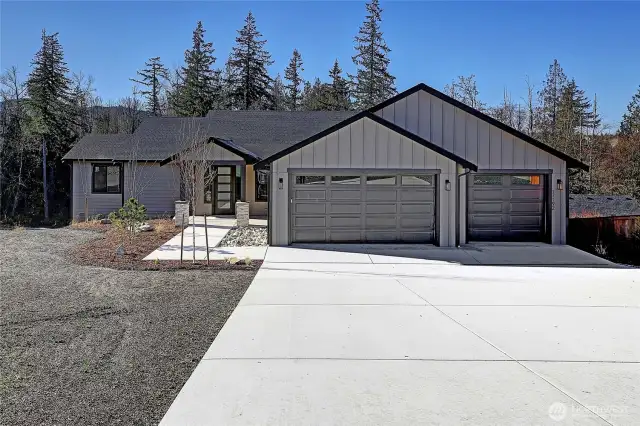 One level home with a three car garage and no steps into the home.
