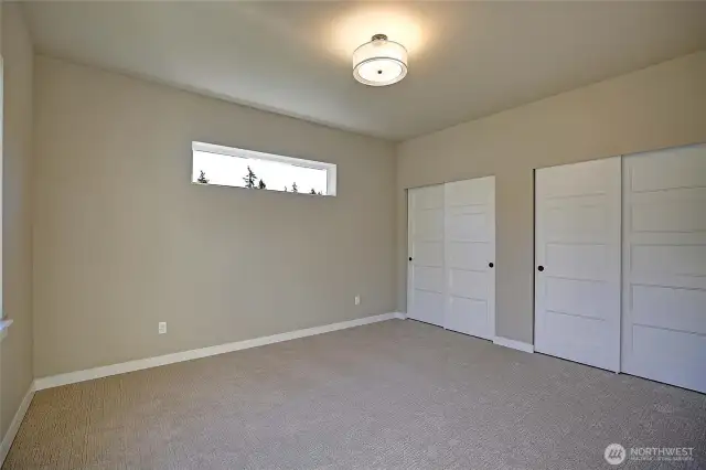 Second bedroom has double closet for plenty of storage.