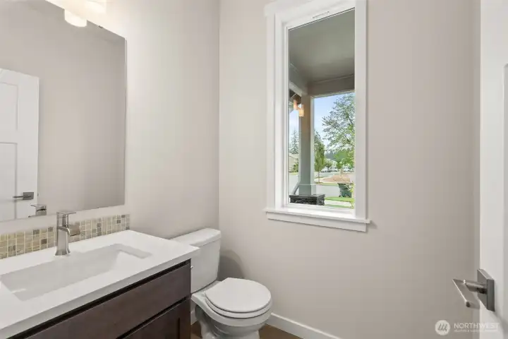 Main floor half bath is perfect for guests.