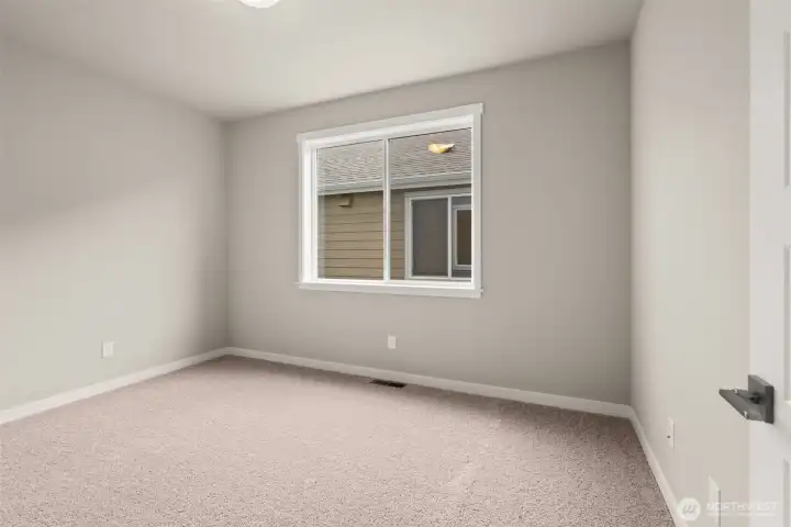 Junior suite with bathroom on main floor is a great option as a guest room or a second primary option without stairs.