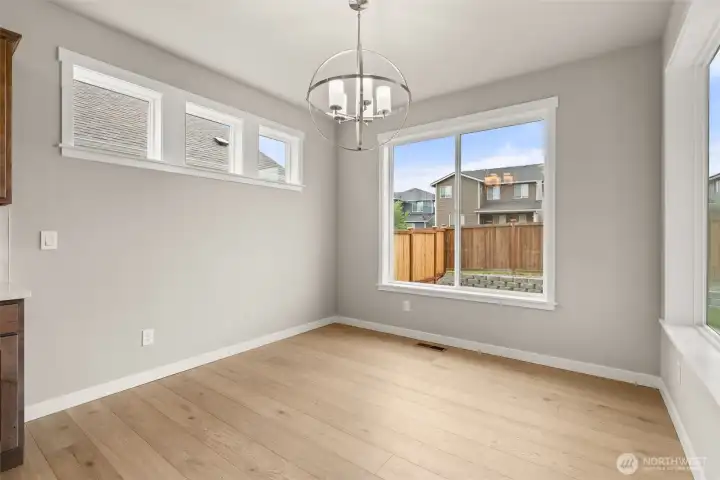 Lovely dining nook with tons of natural light flowing through.