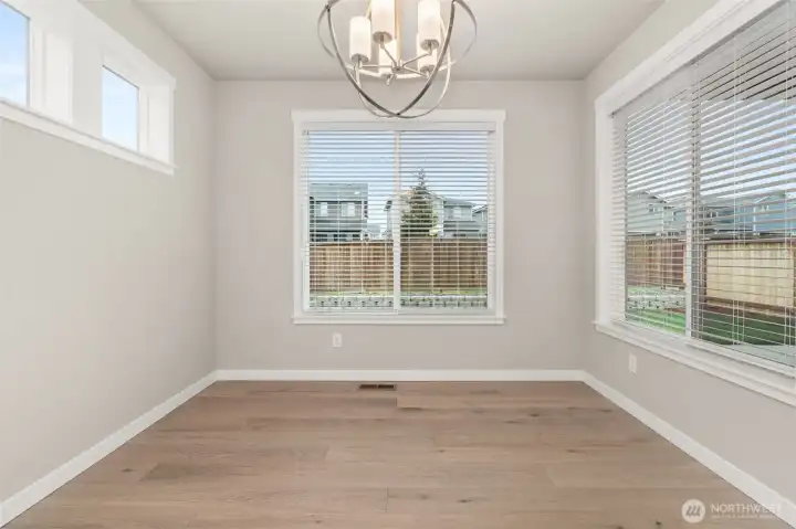 Lovely dining nook with tons of natural light flowing through.