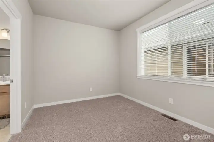 Junior suite with bathroom on main floor is a great option as a guest room or a second primary option without stairs.