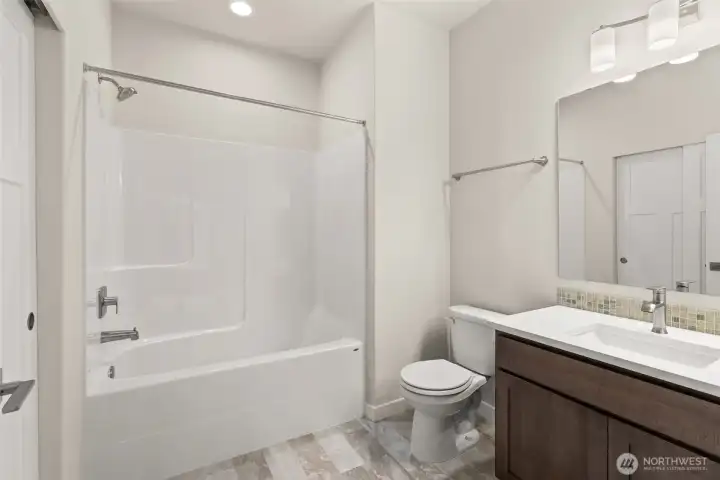 Jr. Suite full bathroom with shower/tub combo on main floor.