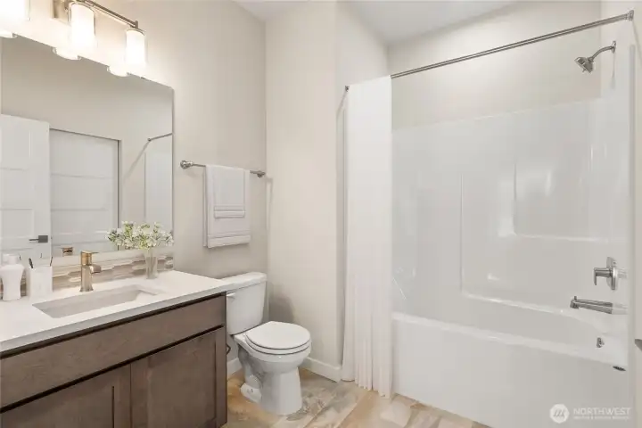 Virtually staged photo Jr. suite bath for illustration.