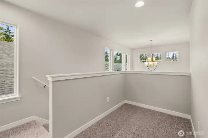 Second floor landing area features a great flexible space, perfect for studying or perhaps a reading nook.