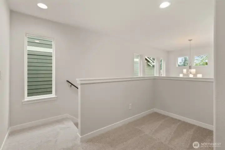 Second floor landing area features a great flexible space, perfect for studying or perhaps a reading nook.
