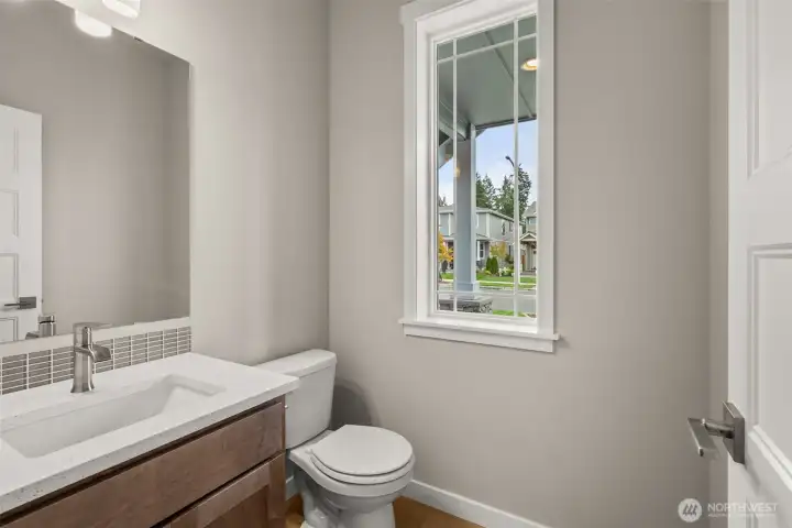 Main floor half bath is perfect for guests.