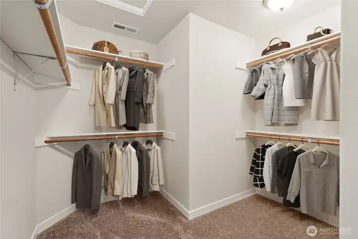 Virtually staged photo primary closet for illustration.