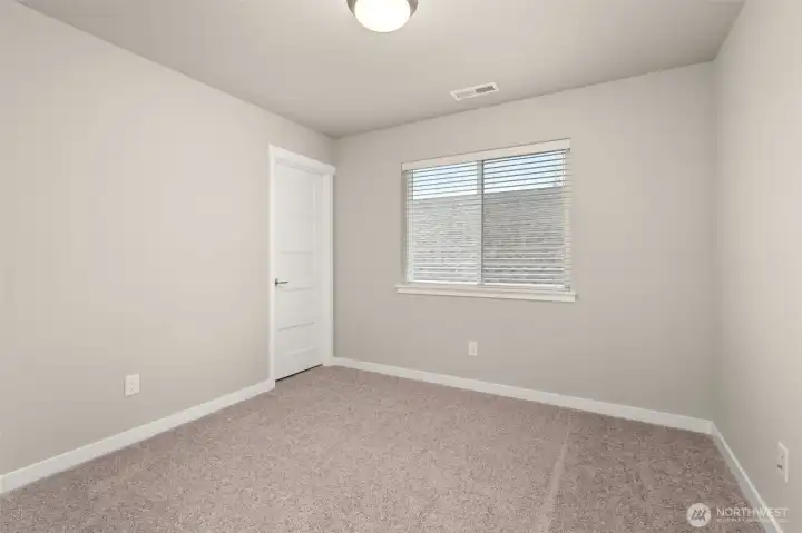 Third bedroom with 8' ceiling with a walk-in closet and prewired for internet.