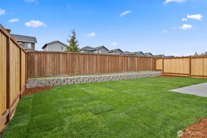 Fully landscaped and privacy-fenced backyard.