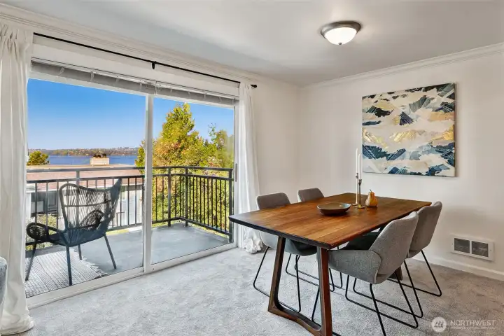 Dining area with slider to view deck. Large slider provides loads of natural sunlight and year-round views of the water, mountains and cityscape. BBQs on decks ok!