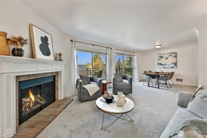Main living area with tiled wood fireplace and mantle, new Karastan carpet and fresh paint.