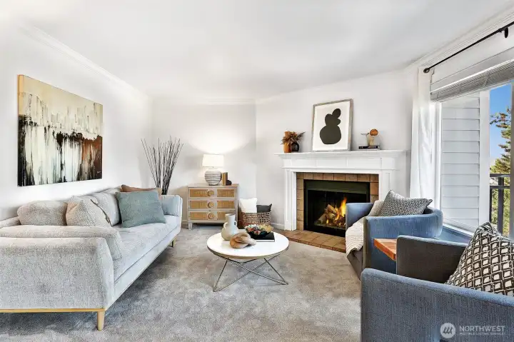 Main living area with tiled wood fireplace and mantle, new Karastan carpet and fresh paint.