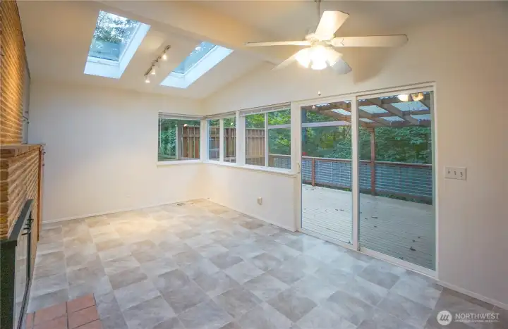 Family Room As Is with Sliders to Wraparound Deck