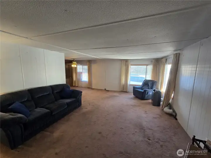 Spacious family room flows to dining room