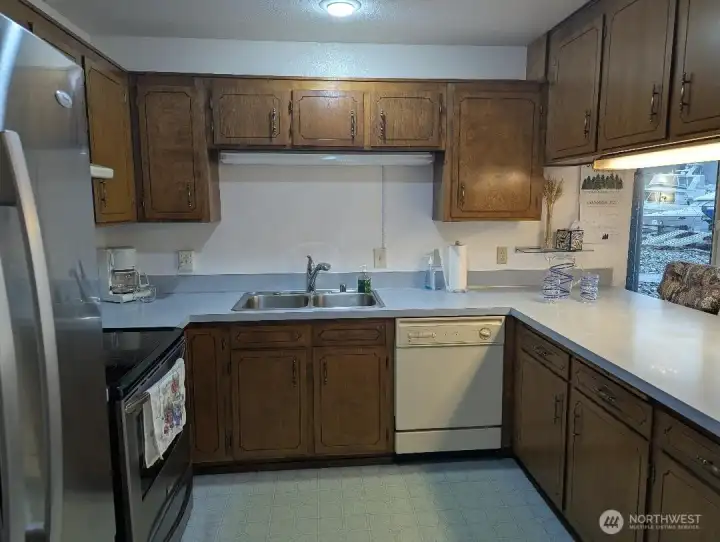 Nice kitchen with lots of counterspace and lots of cabinets. It also has a wonderful view!