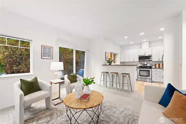 Family room with slider doors leading to the an oversized backyard patio.
