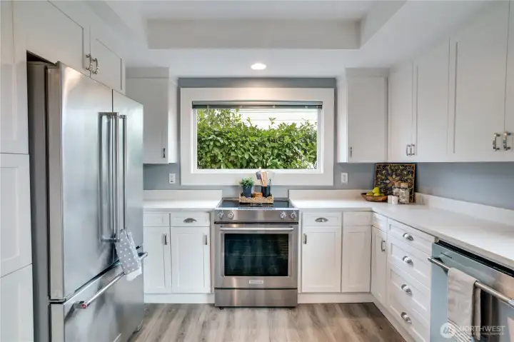 Freshly painted cabinets offer abundant storage, keeping your cooking essentials organized and within easy reach.