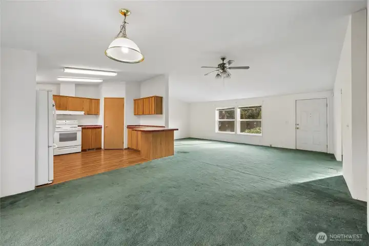 Light and bright entry with living room and dining room.