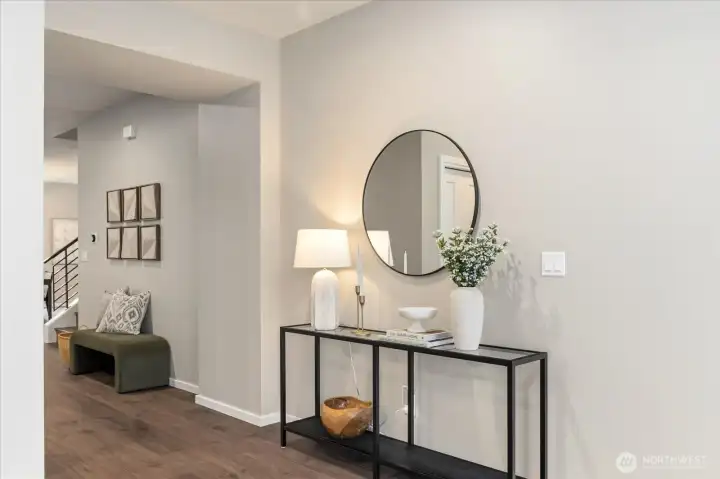 Experience a seamless transition into the home where premium hardwoods and a designer-curated palette flow consistently across both levels. No carpet in the home!