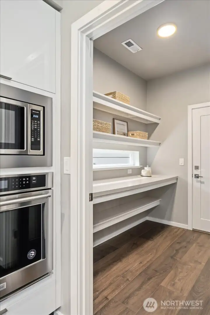 The Butler’s Pantry: Walkthrough layout strategically designed for a streamlined lifestyle.