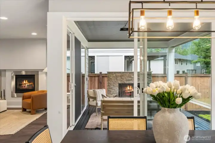 A designated dining space framed by natural light and outdoor views creates an inviting setting for both casual meals and gatherings.