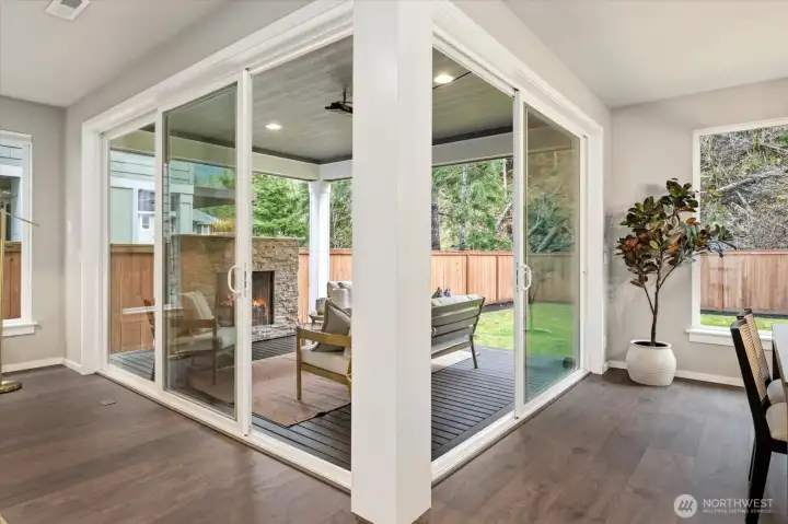 A wall of oversized windows create a seamless indoor-outdoor connection from the great room to the private backyard.