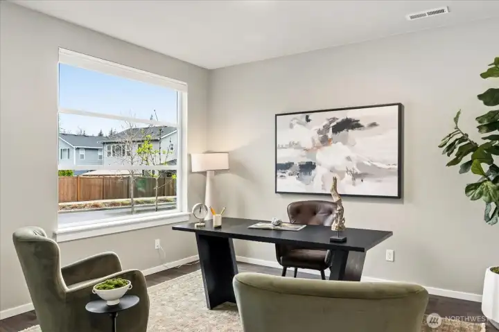 The Professional Office/Den: Main-level retreat designed for focus and productivity.