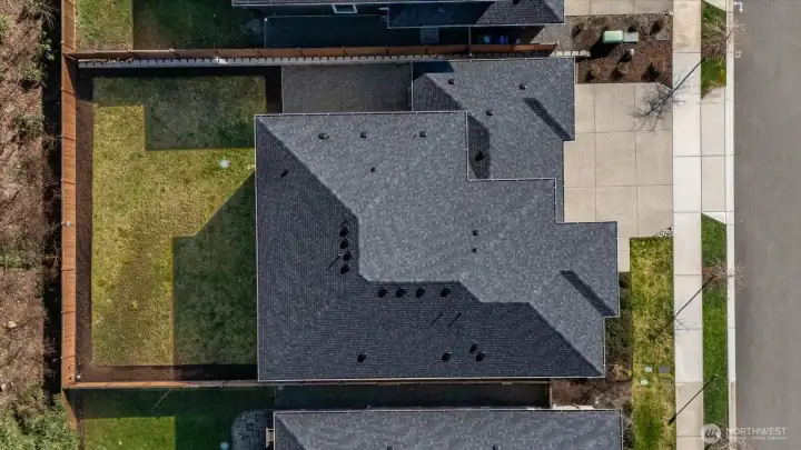 A generous, fully fenced backyard offers space to live, play, and gather.