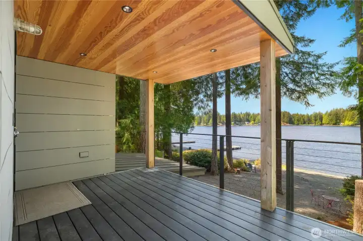 Your covered deck looking to the lake - large enough to fit chairs and a table.