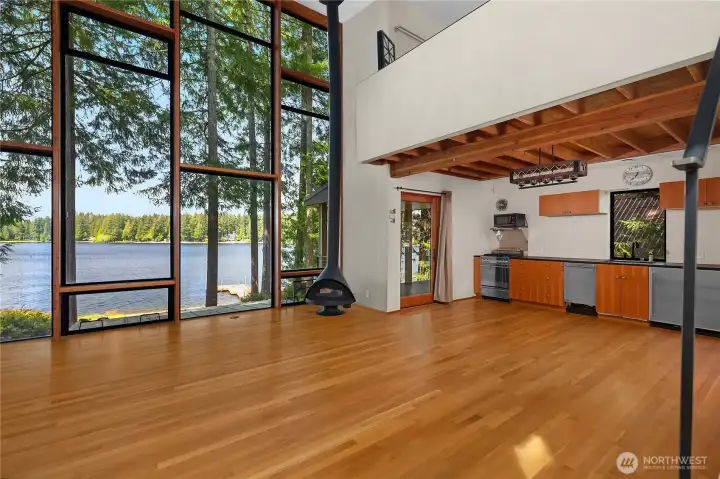 Floor to ceiling windows frame the lake.