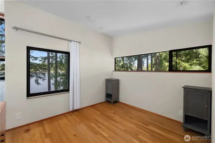 Primary bedroom with a view! Wake up to the lake everyday.