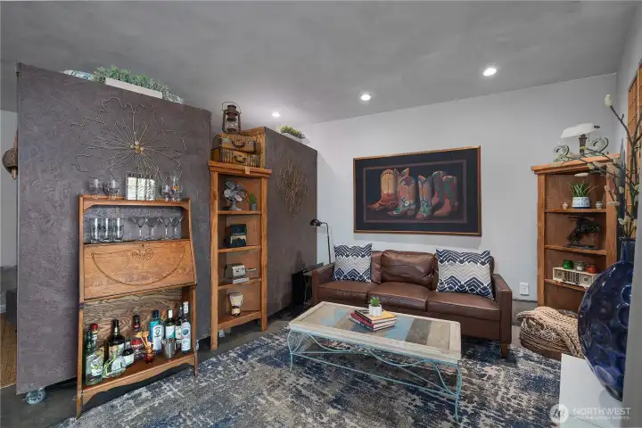 Living room in the studio - partition is one side wall, one side closet.