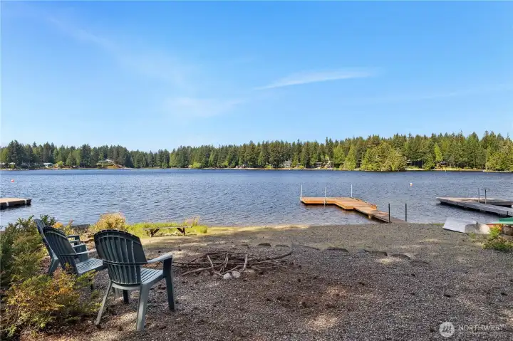 Beach time! Open and expansive beach with your private dock.