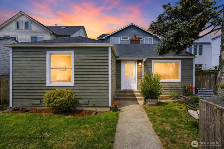 Inviting gated entrance leading to  fully fenced yard. Digitally enhanced twilight.