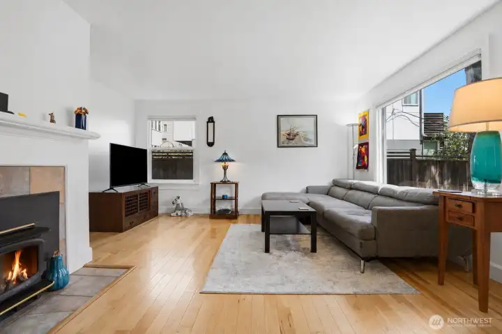 Light and bright living room with fireplace.