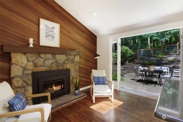 Gas fireplace in the kitchen sitting area. Frensh doors give easy access to the back patio.