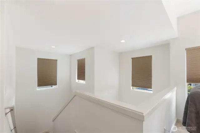 View from upstairs loft looking down the staircase. Blinds are remotely operated.