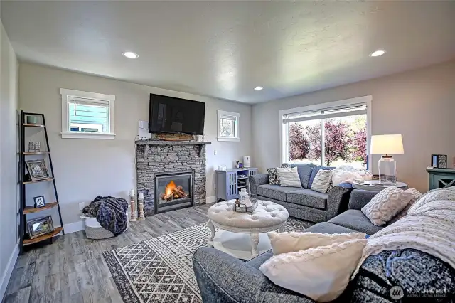 Immediately greeted by large living room w/gas fireplace.