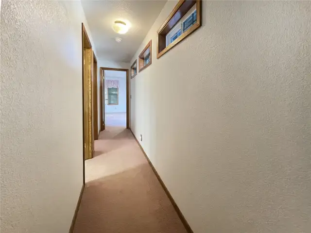 Hallway see transom windows above.