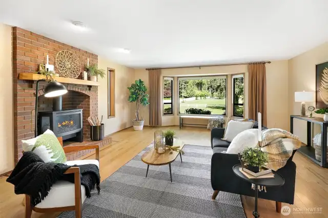 Open living room with large windows allowing a lot of natural light.