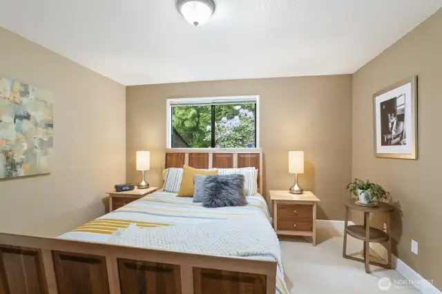 Primary bedroom with private bath and walk-in closet.